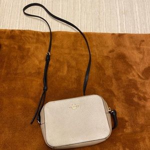 Coach crossbody, colors cream, tan, and black.